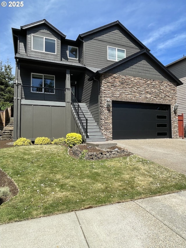 view of front of property featuring stone siding, an attached garage, a front yard, driveway, and stairs