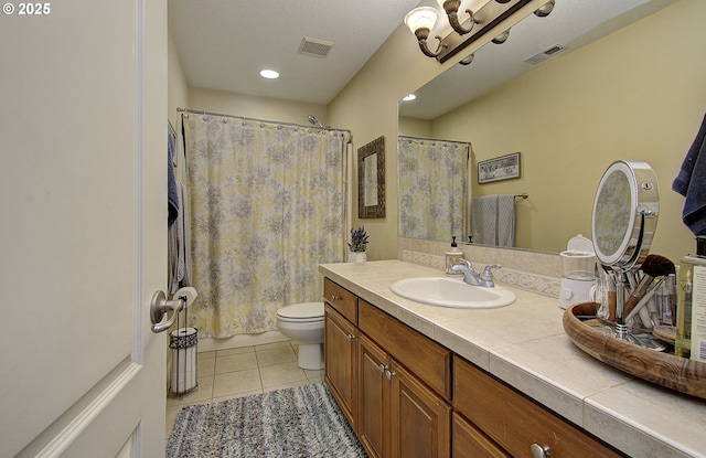 full bathroom featuring toilet, tile patterned floors, visible vents, vanity, and recessed lighting