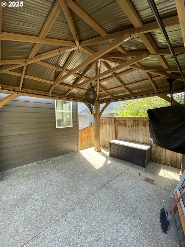 view of patio with a gazebo and fence