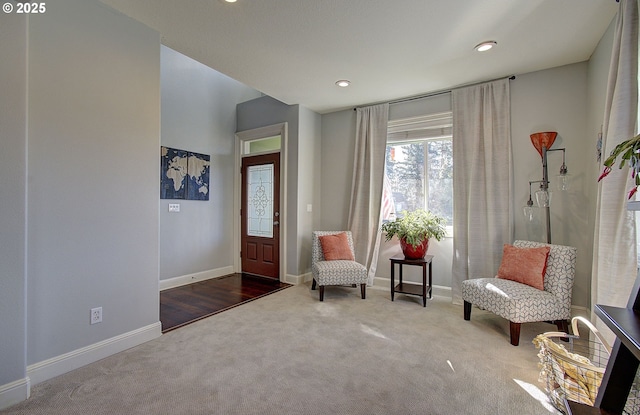 living area featuring baseboards, carpet flooring, and recessed lighting