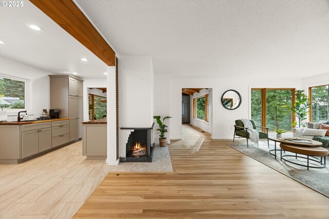 2390 Southshore Blvd, Lake Oswego, OR 97034 - living room with recessed lighting, light wood-style floors, and a fireplace