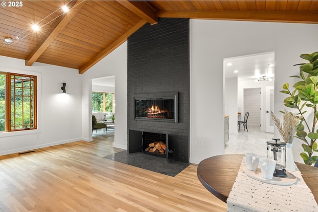 2390 Southshore Blvd, Lake Oswego, OR 97034 - living room featuring a brick fireplace, wood ceiling, and light wood-style flooring