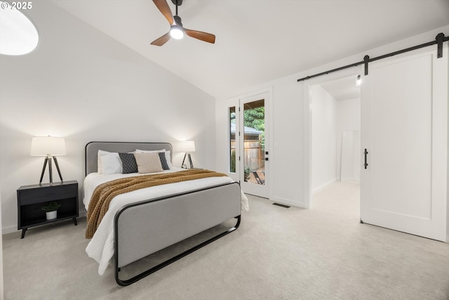 2390 Southshore Blvd, Lake Oswego, OR 97034 - bedroom featuring a barn door, access to outside, light carpet, lofted ceiling, and a ceiling fan