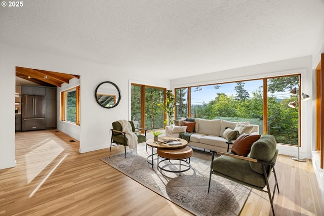 2390 Southshore Blvd, Lake Oswego, OR 97034 - living area with a textured ceiling and light wood-type flooring