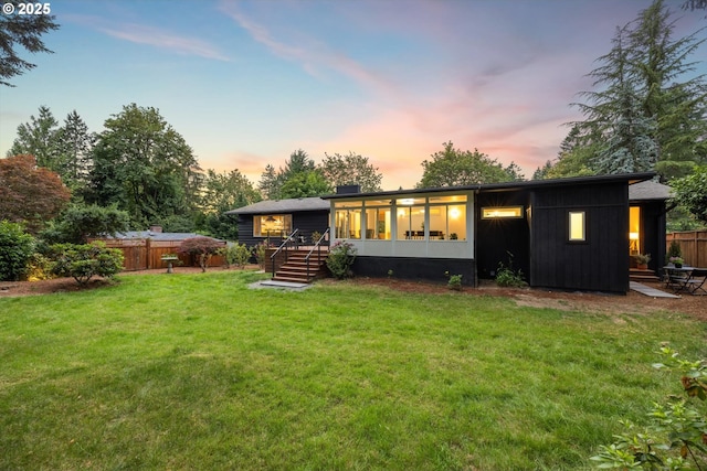 2390 Southshore Blvd, Lake Oswego, OR 97034 - back of house at dusk with a sunroom