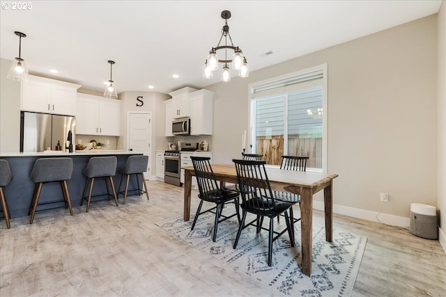 209 W Barbaras Way, Newberg, OR 97132 - dining space with a chandelier, light wood-style floors, and recessed lighting