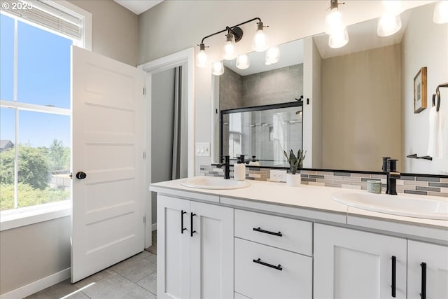 209 W Barbaras Way, Newberg, OR 97132 - bathroom with double vanity, a shower stall, backsplash, and plenty of natural light