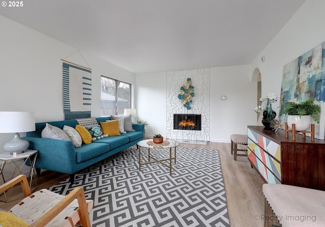 living room with hardwood / wood-style floors and a fireplace