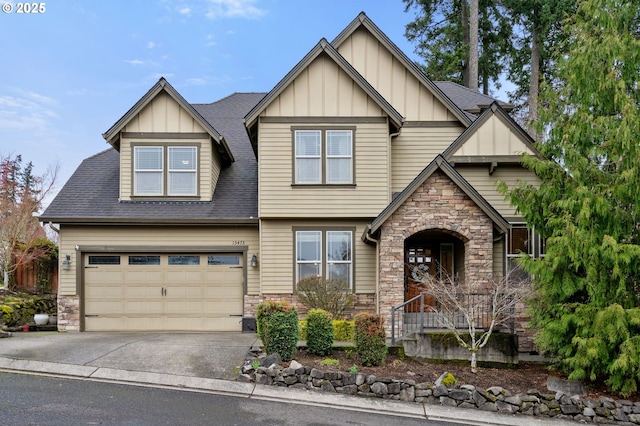 craftsman house with a garage, aphalt driveway, stone siding, a shingled roof, and board and batten siding