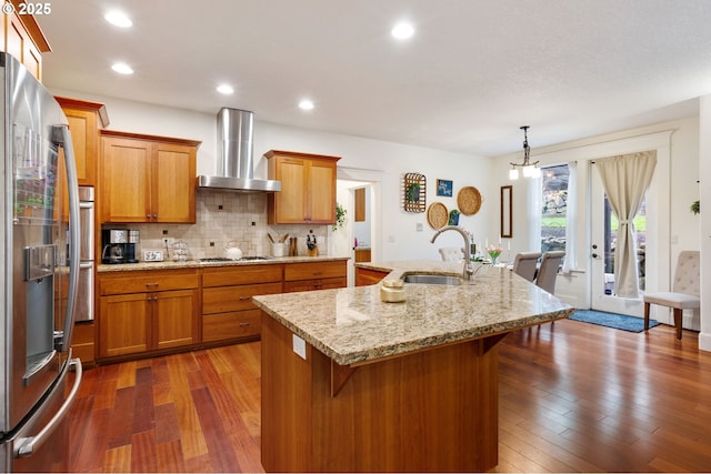 15475 SW Brighton Way, Beaverton, OR 97007 - kitchen with a sink, wall chimney range hood, gas cooktop, stainless steel refrigerator with ice dispenser, and dark wood finished floors