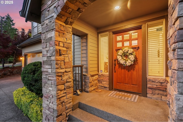 15475 SW Brighton Way, Beaverton, OR 97007 - entrance to property featuring stone siding and an attached garage