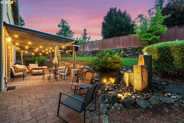 15475 SW Brighton Way, Beaverton, OR 97007 - fenced backyard with a patio and outdoor dining area