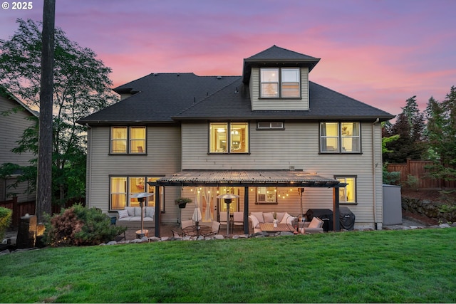 15475 SW Brighton Way, Beaverton, OR 97007 - back of property at dusk featuring an outdoor living space and a patio