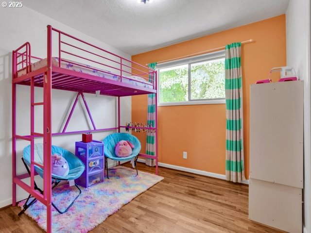 3185 14th Ave, Albany, OR 97322 - bedroom featuring wood finished floors and baseboards