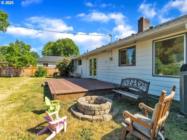 3185 14th Ave, Albany, OR 97322 - back of property featuring an outdoor fire pit, a deck, and a chimney