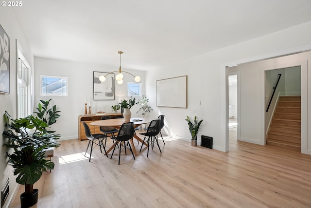 2615 N Gammans Pl, Portland, OR 97217 - dining space featuring light wood-type flooring, healthy amount of natural light, and stairs