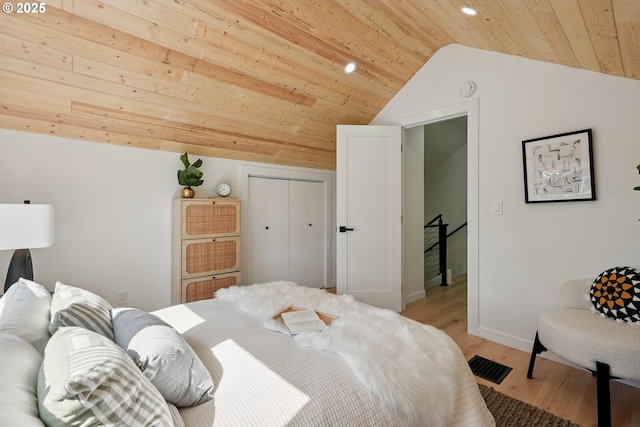 2615 N Gammans Pl, Portland, OR 97217 - bedroom with lofted ceiling, wooden ceiling, light wood-style flooring, recessed lighting, and a closet