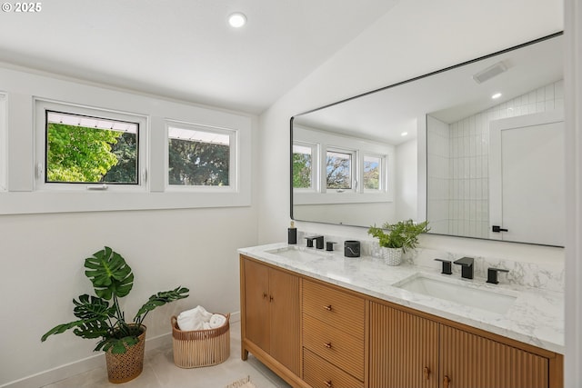 2615 N Gammans Pl, Portland, OR 97217 - bathroom featuring double vanity, lofted ceiling, and recessed lighting