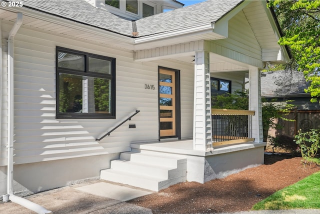 2615 N Gammans Pl, Portland, OR 97217 - view of exterior entry featuring a porch and roof with shingles