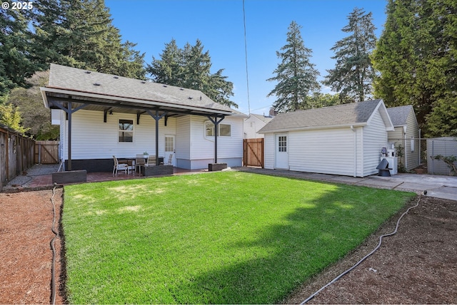 2615 N Gammans Pl, Portland, OR 97217 - back of house with a gate, a patio area, and a fenced backyard