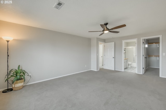 unfurnished bedroom with visible vents, baseboards, and carpet