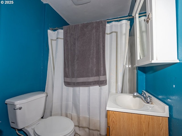 full bathroom with toilet, vanity, and curtained shower