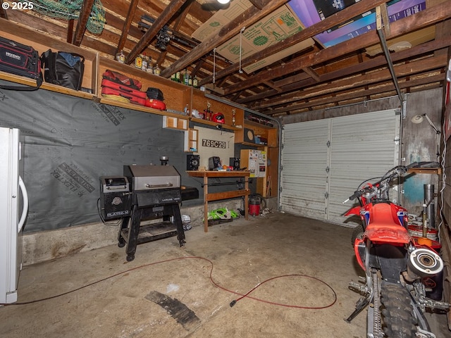 garage with freestanding refrigerator