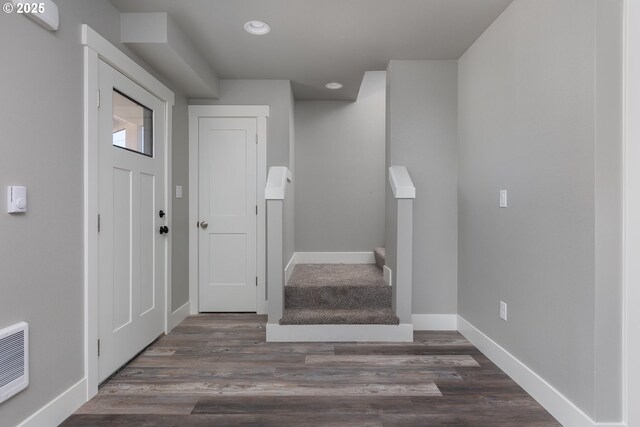 entrance foyer featuring dark hardwood / wood-style flooring