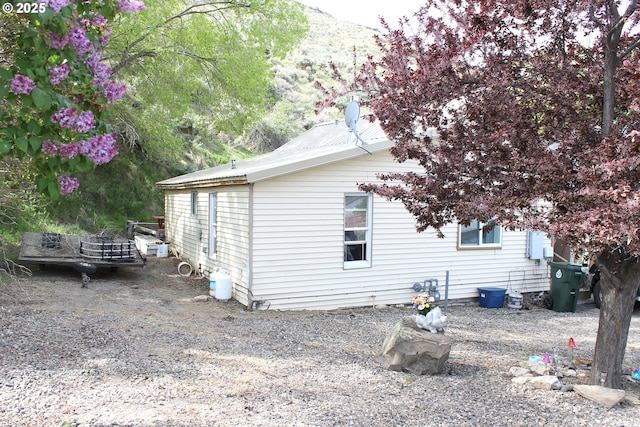 831 Place St, Baker City, OR 97814 - view of side of property featuring a mountain view and metal roof