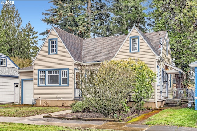 view of front of home featuring a shingled roof