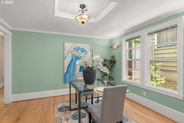 4113 SE Rural St, Portland, OR 97202 - dining area featuring wood finished floors, crown molding, and a textured ceiling