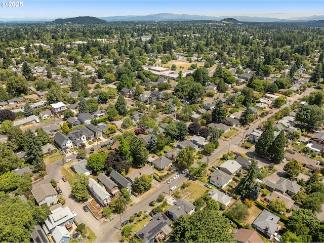 4113 SE Rural St, Portland, OR 97202 - aerial view of property's location featuring a mountainous background and nearby suburban area