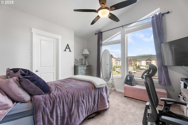 11465 SE Pleasant Valley Pkwy, Happy Valley, OR 97086 - bedroom with lofted ceiling, light colored carpet, ceiling fan, a desk, and baseboards