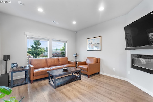 11465 SE Pleasant Valley Pkwy, Happy Valley, OR 97086 - living area featuring light wood finished floors, recessed lighting, and baseboards