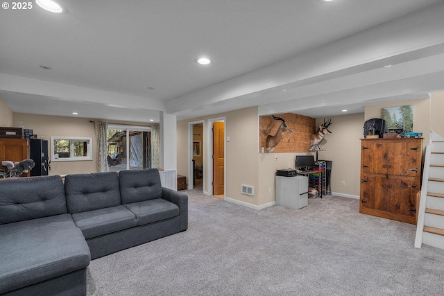 carpeted living area with recessed lighting and baseboards