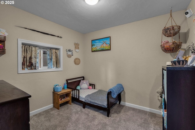 bedroom with baseboards and carpet flooring