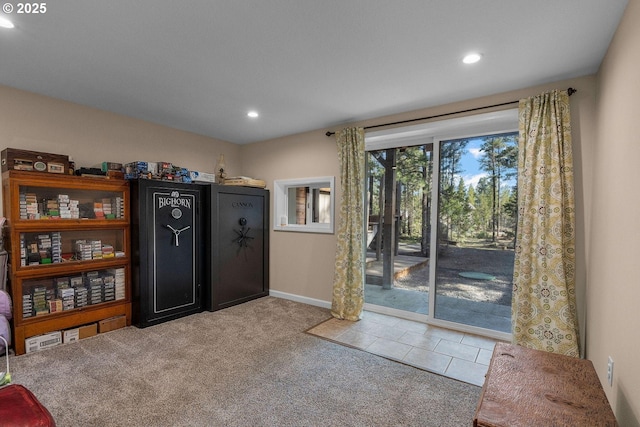 doorway featuring recessed lighting, carpet, and baseboards