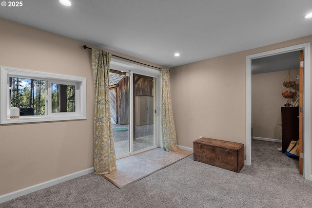carpeted empty room with recessed lighting and baseboards