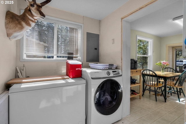 washroom with electric panel and washing machine and dryer