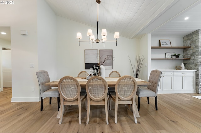 dining space with a chandelier, light wood finished floors, lofted ceiling, baseboards, and recessed lighting