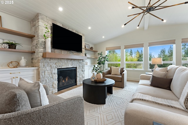 living room with light wood finished floors, vaulted ceiling, a fireplace, a chandelier, and recessed lighting