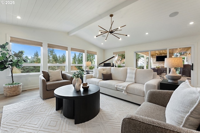 living room featuring wood finished floors, plenty of natural light, a chandelier, recessed lighting, and baseboards