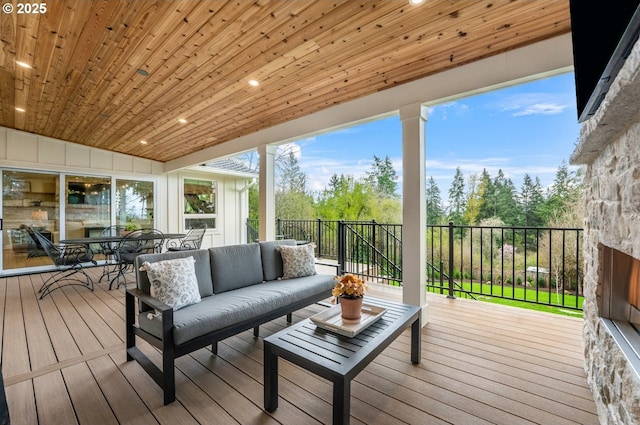 deck with an outdoor living space and outdoor dining space