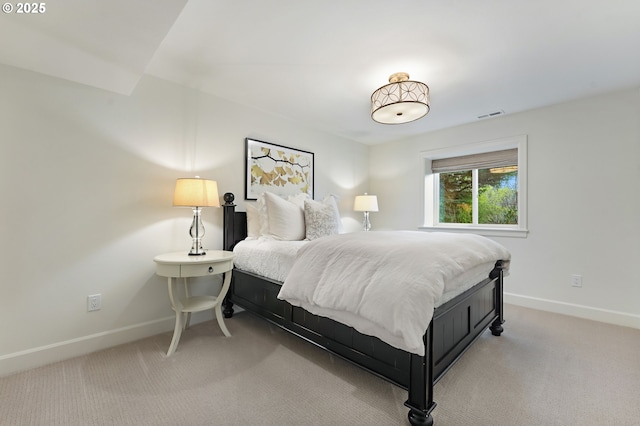 carpeted bedroom featuring baseboards
