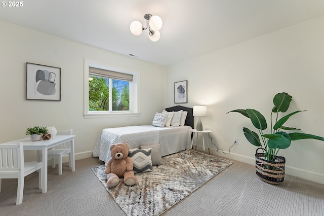 bedroom featuring carpet and baseboards