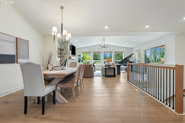 dining area with a chandelier, vaulted ceiling, wood-type flooring, baseboards, and recessed lighting