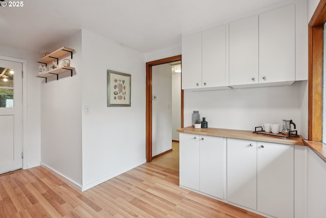 10544 SE Home Ave, Milwaukie, OR 97222 - kitchen with light wood-type flooring, white cabinetry, and open shelves