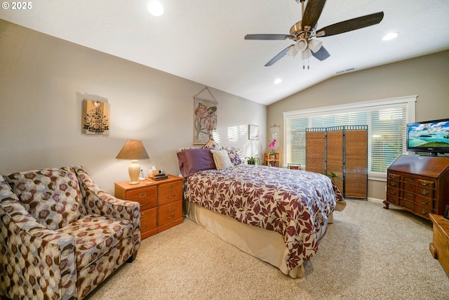 carpeted bedroom with vaulted ceiling and ceiling fan