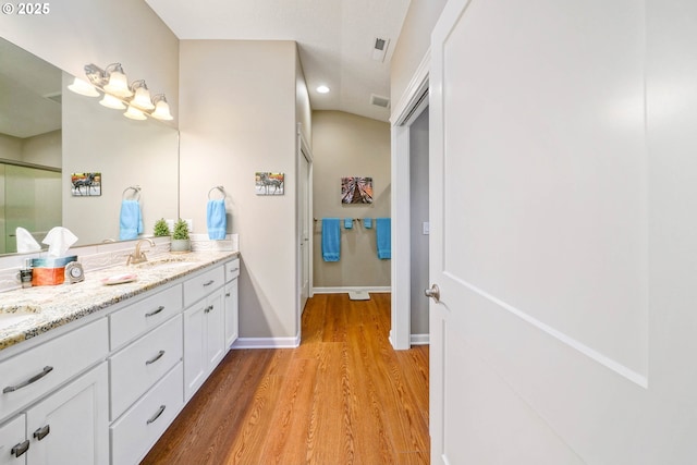 bathroom featuring vanity and hardwood / wood-style flooring