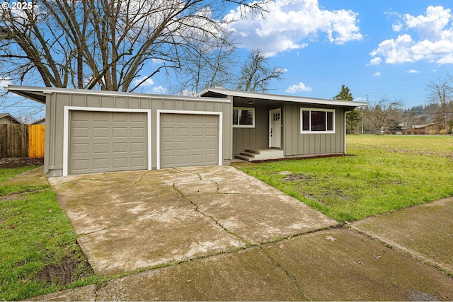 ranch-style house with a garage and a front lawn